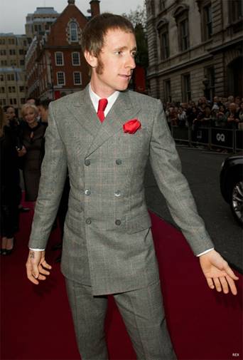 Bradley Wiggins – looking confident and business-like in a grey Prince of Wales with a red windowpane overcheck, and matching tie and pocket square.